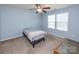 Bedroom featuring a ceiling fan and natural light with carpeted floors at 7412 Greene Mill Sw Ave, Concord, NC 28025