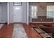 Bright foyer boasts hardwood floors and neutral walls, adjacent to the dining area at 7412 Greene Mill Sw Ave, Concord, NC 28025