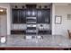 The kitchen features a large island, stainless appliances, and dark cabinets at 7412 Greene Mill Sw Ave, Concord, NC 28025