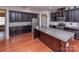 A kitchen features stainless steel appliances, an island, and granite countertops at 7412 Greene Mill Sw Ave, Concord, NC 28025