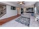 Living room featuring hardwood floors and opens to the kitchen at 7412 Greene Mill Sw Ave, Concord, NC 28025