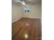 Bedroom with hardwood floors, a ceiling fan, and a window air conditioner at 7431 Idlewild Rd, Charlotte, NC 28212