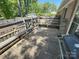 Outdoor wooden deck featuring built-in benches, ideal for outdoor seating at 7431 Idlewild Rd, Charlotte, NC 28212