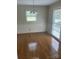 Traditional dining room featuring classic wallpaper and hardwood floors at 7431 Idlewild Rd, Charlotte, NC 28212