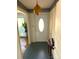 Inviting foyer with vintage light fixture, decorated wallpaper, and tiled floor at 7431 Idlewild Rd, Charlotte, NC 28212