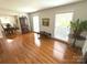 Bright living room featuring hardwood flooring and natural light at 7431 Idlewild Rd, Charlotte, NC 28212