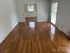 Bright living room with hardwood floors and lots of natural light at 7431 Idlewild Rd, Charlotte, NC 28212
