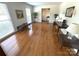 Spacious living room with hardwood flooring, large windows, and neutral walls at 7431 Idlewild Rd, Charlotte, NC 28212