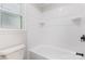 Bright, tiled bathroom with white fixtures and window at 781 Summerwood Dr, Rock Hill, SC 29732