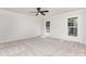 Spacious bedroom with plush carpet, two windows bringing in plenty of natural light, and a ceiling fan at 781 Summerwood Dr, Rock Hill, SC 29732