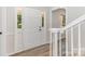 Bright entryway featuring wood floors, staircase and a white front door at 781 Summerwood Dr, Rock Hill, SC 29732