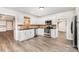 Bright kitchen showcases stainless steel appliances, white cabinetry, and hardwood style flooring at 781 Summerwood Dr, Rock Hill, SC 29732