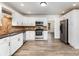 This kitchen features white cabinetry, stainless steel appliances, and hardwood style flooring at 781 Summerwood Dr, Rock Hill, SC 29732