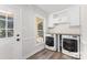Laundry room features a window for natural light, a counter, and modern washer and dryer at 781 Summerwood Dr, Rock Hill, SC 29732