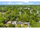 An aerial perspective that features homes surrounded by lush trees, and several cars parked in their driveways at 7905 Quail Field Dr, Charlotte, NC 28227