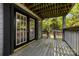Wooden back porch showcasing outdoor living with views of the backyard and access to natural light at 7905 Quail Field Dr, Charlotte, NC 28227