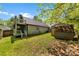 Large backyard featuring a patio, shed, and ample green space, perfect for outdoor activities and relaxation at 7905 Quail Field Dr, Charlotte, NC 28227