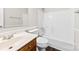 A clean bathroom featuring a white vanity, toilet, and tub/shower combination at 7905 Quail Field Dr, Charlotte, NC 28227