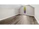 Bedroom with hardwood floors and a door leading to a balcony/outdoor area at 7905 Quail Field Dr, Charlotte, NC 28227