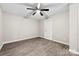Neutral bedroom features new flooring and a modern ceiling fan at 7905 Quail Field Dr, Charlotte, NC 28227