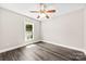 Bright bedroom with modern flooring and natural light from the window at 7905 Quail Field Dr, Charlotte, NC 28227