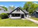 Charming home with gray siding, black trim, well-manicured lawn, and inviting front porch for curb appeal at 7905 Quail Field Dr, Charlotte, NC 28227