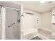Bathroom featuring tiled shower and tub combo with modern black hardware at 828 Richard Ave, Kannapolis, NC 28081