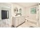 Modern bathroom featuring double vanity, fresh paint, and updated plumbing fixtures at 828 Richard Ave, Kannapolis, NC 28081