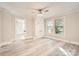 Spacious bedroom featuring a modern ceiling fan, built-in wardrobe, and large windows at 828 Richard Ave, Kannapolis, NC 28081