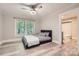 Comfortable bedroom featuring fresh paint, modern ceiling fan, and light gray vinyl flooring at 828 Richard Ave, Kannapolis, NC 28081