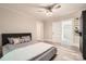 Bright bedroom featuring modern ceiling fan, fresh paint, and light gray vinyl flooring at 828 Richard Ave, Kannapolis, NC 28081