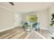 Cozy living room with hardwood floors, great natural light, and seating area with table at 828 Richard Ave, Kannapolis, NC 28081