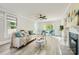 Sunlit living room boasts stylish decor and a cozy fireplace at 828 Richard Ave, Kannapolis, NC 28081