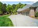 Spacious driveway and three car garage, offering ample parking at 8670 Arbor Oaks Cir, Concord, NC 28027