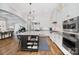 Gourmet kitchen featuring a center island, custom cabinetry, and high-end appliances at 8670 Arbor Oaks Cir, Concord, NC 28027