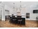 Modern kitchen with island seating, stainless steel appliances, and pendant lighting at 8670 Arbor Oaks Cir, Concord, NC 28027