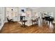 Elegant living room with fireplace, built-in shelves, and hardwood floors at 8670 Arbor Oaks Cir, Concord, NC 28027