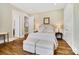 Serene main bedroom with neutral tones, hardwood floors, and recessed lighting at 8670 Arbor Oaks Cir, Concord, NC 28027