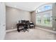Bright office space with arched window, plantation shutters, and desk with three monitors at 8670 Arbor Oaks Cir, Concord, NC 28027