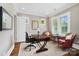 Bright office space with natural light, hardwood floors, and comfortable seating at 8670 Arbor Oaks Cir, Concord, NC 28027