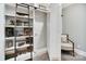 Hidden room behind bookshelf with secret door, chair, and wooden rolling ladder at 8670 Arbor Oaks Cir, Concord, NC 28027