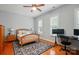 Bedroom featuring natural light, a desk area, and a ceiling fan at 9652 Wheatfield Rd, Charlotte, NC 28277