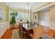 Bright dining room with natural light, a large table, and views of the outdoors at 9652 Wheatfield Rd, Charlotte, NC 28277