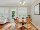 Cozy dining area with a round wood table, natural light, and a view of the outdoors at 9652 Wheatfield Rd, Charlotte, NC 28277