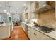Bright kitchen with granite countertops, stainless steel appliances, and hardwood floors at 9652 Wheatfield Rd, Charlotte, NC 28277