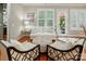Comfortable living room featuring hardwood floors, fireplace, and access to the patio at 9652 Wheatfield Rd, Charlotte, NC 28277
