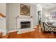Cozy living room with a fireplace, hardwood floors, and neutral decor at 9652 Wheatfield Rd, Charlotte, NC 28277