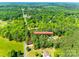 Aerial view pinpointing the home's location, highlighting its natural surroundings, and nearby street access at 1006 Chambers Rd, York, SC 29745