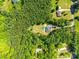 Expansive lot aerial view showcasing the home's treed surroundings, providing privacy and a sense of seclusion at 1006 Chambers Rd, York, SC 29745
