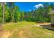 Sprawling yard featuring mature trees, a lush lawn and an above ground pool at 1006 Chambers Rd, York, SC 29745